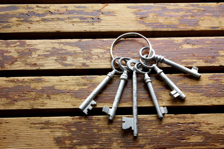 Bunch of Keys on Wooden Backgroundの写真素材