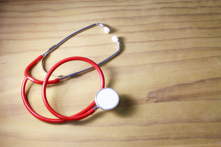 Stethoscope on Wooden Backkgroundの写真素材