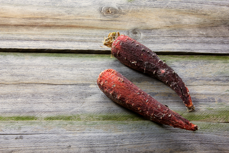 Rotten Carrots on Wooden Backgroundの写真素材