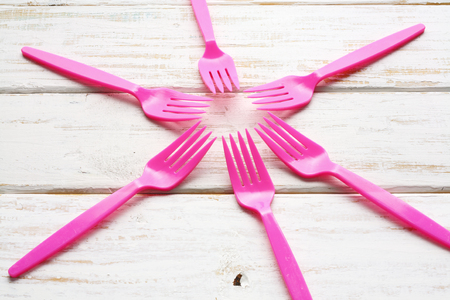 Plastic Forks on Wooden Backgroundの写真素材