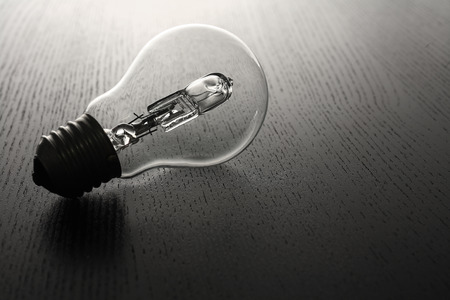 Lightbulb on Wooden Backgroundの写真素材