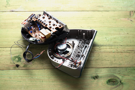 Broken clock Radio on Wooden Backgroundの写真素材