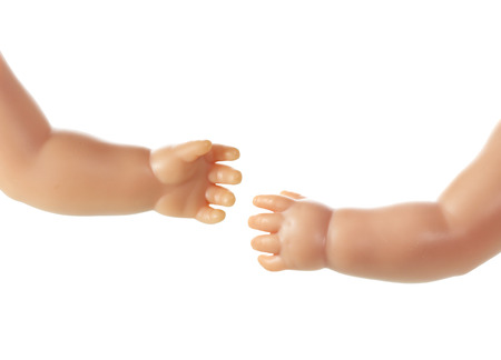 Doll Hands on White Backgroundの写真素材