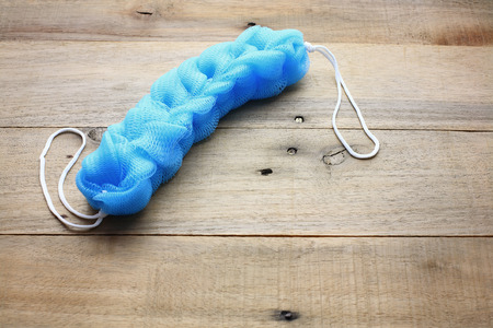 Body Scrubber on Wooden Backgroundの写真素材