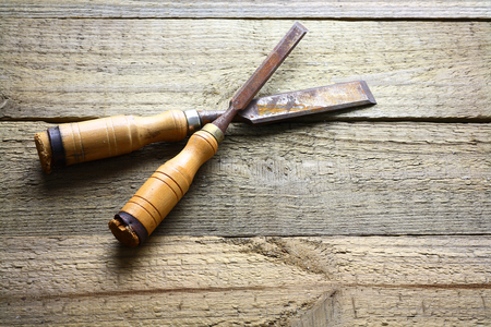 Chisels on Wooden Background