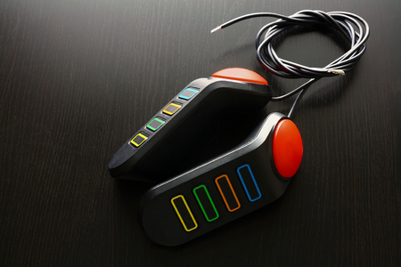 Game Controllers on Wooden Backgroundの写真素材