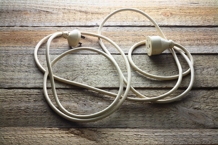 Extension Cord on Wooden Backgroundの写真素材