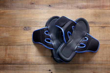 Slippers on Wooden Background