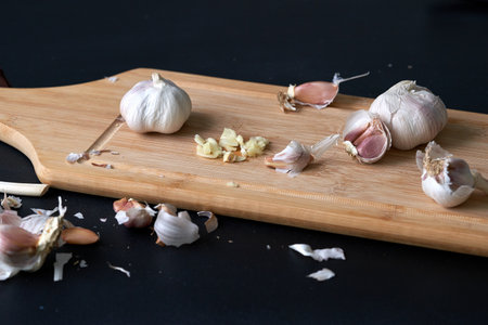 Chopped garlic on kitchen board.の写真素材