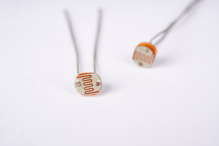 Electronic parts photoresistor on white background.