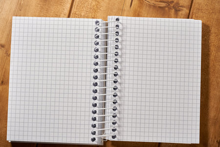 Spiral notebook checkered close up, close up.