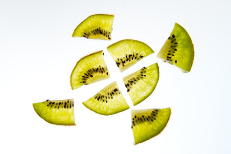 Fruit lemon and kiwi sliced into slices white background.の写真素材