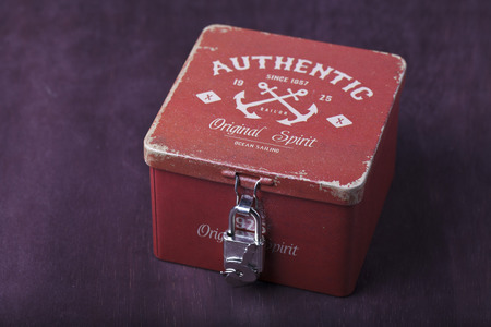 Vintage red box on a brown backgroundの写真素材