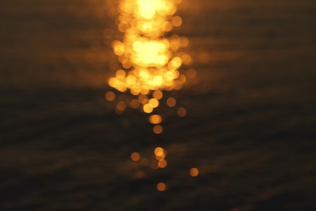 a sun glare on the water, beautiful backgroundの写真素材