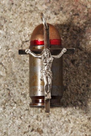 a Bullet and pectoral cross , abstract religionの写真素材