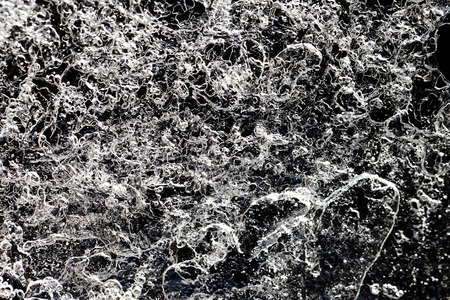 a frozen water ice texture background pattern with cracksの写真素材