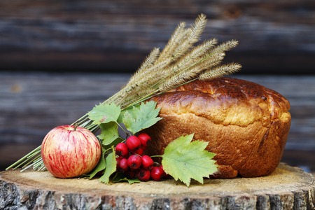 fragrant homemade bread with a ruddy crust on a wooden backgroundの写真素材