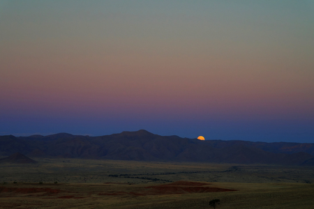 Full moon ascends over the dune in Namib desertの写真素材