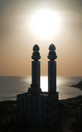 Contre-jour view to Mosque of the Divinity at sunset in Dakar, Senegalの写真素材