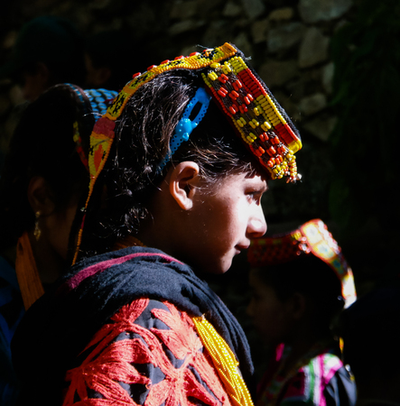 Portrait of Kalash tribe woman in national costume at Joshi fest - 14-05-2015 Bumburet, Kunar, Pakistanのeditorial素材
