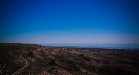 Panorama view to Aral sea from the rim of Plateau Ustyurt near Duana cape in Karakalpakstan, Uzbekistanの写真素材