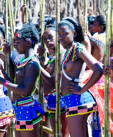 Women in traditional costumes marching at the Umhlanga aka Reed Dance ceremony - 01-09-2013 Lobamba,...