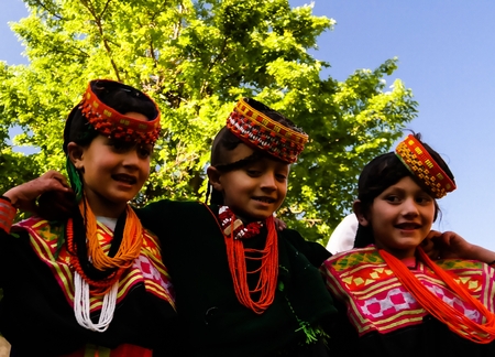 Portrait of Kalash tribe woman in national costume at Joshi fest - 14-05-2015 Bumburet, Kunar, Pakistanのeditorial素材