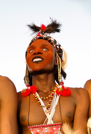 Man dancing Yaake dance and sing at Guerewol festival - 23 september 2017 InGall village, Agadez,...