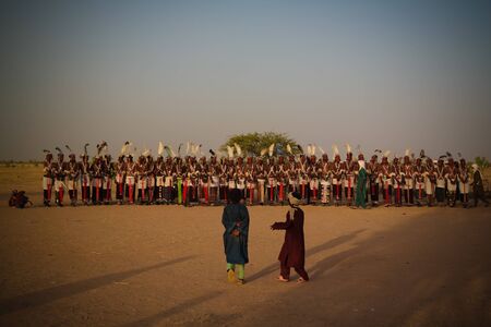 Men dancing Yaake dance and sing at Guerewol festival - 23 september 2017 InGall village, Agadez,...