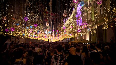 Football fans at Nikolskaya Street in Moscow at FIFA football world cup at night - 23 June 2018, Moscow, Russiaのeditorial素材