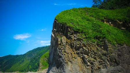 Column basalts formation of Stolbchaty cape at Kunashir at kuril islands, Russia