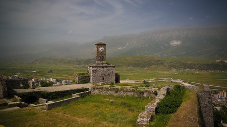 Panoramic view to Gjirokastra castle with the wall, tower and Clock in Gjirokaster, Albaniaのeditorial素材