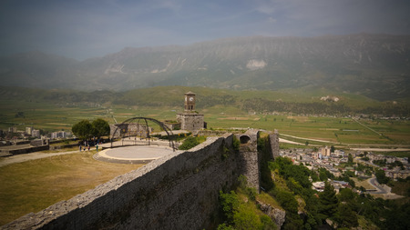 Panoramic view to Gjirokastra castle with the wall, tower and Clock in Gjirokaster, Albaniaのeditorial素材