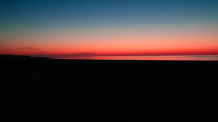 Sunrise Panorama view to Aral sea from the rim of Plateau Ustyurt near Aktumsuk cape , Karakalpakstan, Uzbekistanの写真素材