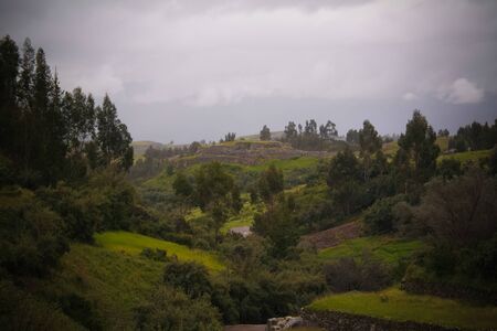 View to ruins of Puca Pucara aka Red Fortress from Tambomachay place at Cuzco, Peruの写真素材