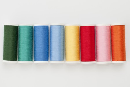 Colorful Spools of sewing thread isolated on white background.の写真素材