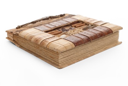 Handcrafted picture album isolated on white background.