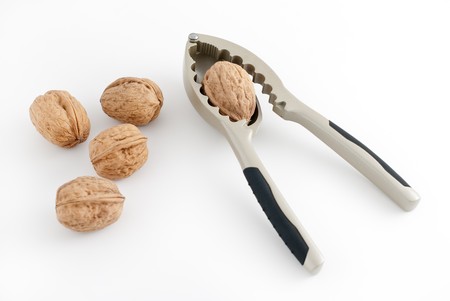 Food background, macro shot of a group of walnuts and a nutcracker.の写真素材
