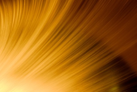 Articial waterfall at night back lit by orange light.の写真素材