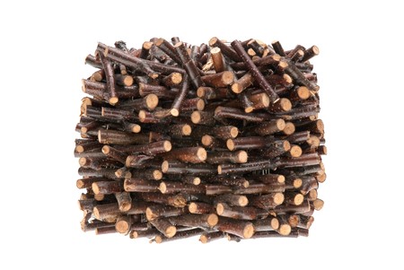 Pile of assorted sawed twigs and branches isolated on white background.の写真素材