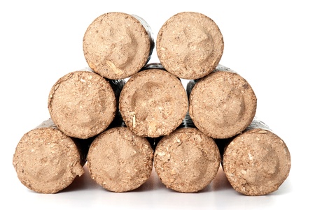 Compacted fireplace wood isolated on white background.の写真素材