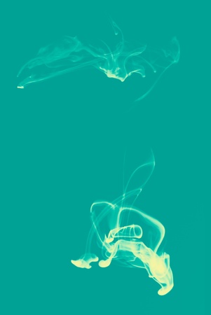 Abstract ink background flow in water on a green background.の写真素材