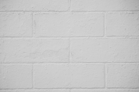 Brick wall painted with a white paint, closeup background.の写真素材