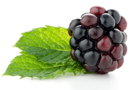 Ripe fresh blackberry with leaves isolated on white background 
