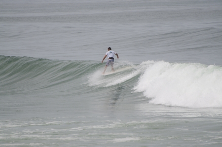 OVAR, PORTUGAL - AUGUST 19: Unidentified surfer at 1st stage of National Longboard Championship  on august 19, 2012 in Ovar, Portugal.のeditorial素材