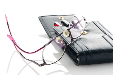 Leather notebook and glasses isolated on white background.の写真素材