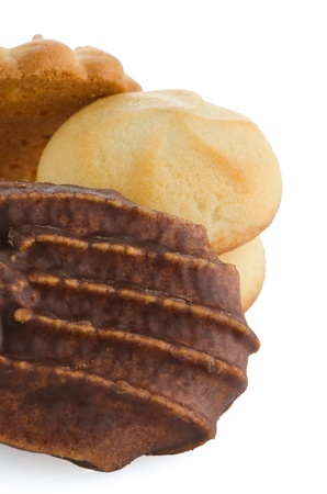 Closeup detail of delicious butter and chocolate cookies on white reflective background.の写真素材