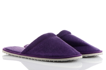 A pair of purple slippers on a white background.の写真素材
