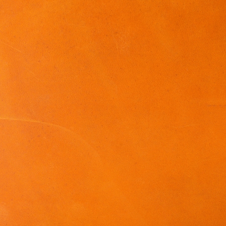 Vivid orange leather backgroundの写真素材