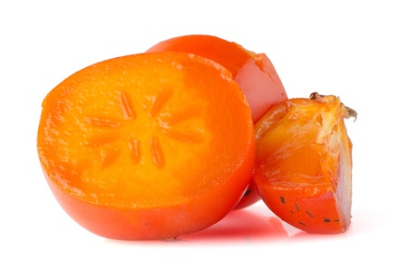 Persimmon. Ripe persimmon with slice isolated on white background.の写真素材